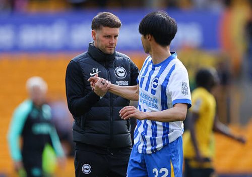 WOLVERHAMPTON, ENGLAND - MAY 10: Fabian Hurzeler, manager of Brighton and Hove Albion, embraces Kaoru Mitoma of Brighton and Hove Albion during the Premier League match between Wolverhampton Wanderers FC and Brighton & Hove Albion FC at Molineux on May 10, 2025 in Wolverhampton, England. (Photo by James Gill - Danehouse/Getty Images)